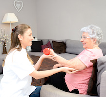 Elderly women having physical rehabilitation at home